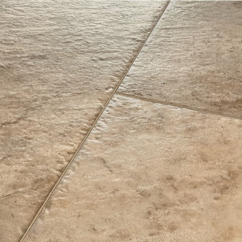 Mannington Luxury Vinyl Adura Apex Luxxe Caviar Close-up of beige tiles with a visible grout line swatch