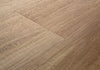 Close-up angled view of Mannington ADURA Flex Noble Oak Bark luxury vinyl plank flooring showing rich dark brown oak grain and texture detail